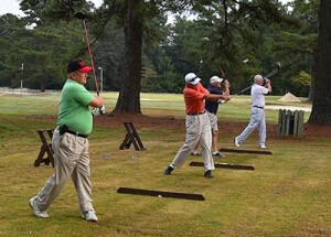 The winning team from the first annual ECC Foundation Golf Tournament in 1985 returned to play again and hit the ceremonial tee ball. From left are 1985 Winning Team members Junior Edmondson, Curtis Edmondson, Charlie Harrell, and Carl Thurber. This group placed fifth in the recent golf tournament, proving that golf is a lifetime sport.