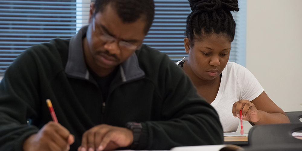 From left, DeVon Weathersbe and Lamiya Harrison take the Career Readiness Certification assessment, which is offered regularly at Edgecombe Community College. The CRC is a nationally recognized program that certifies essential workplace skills.