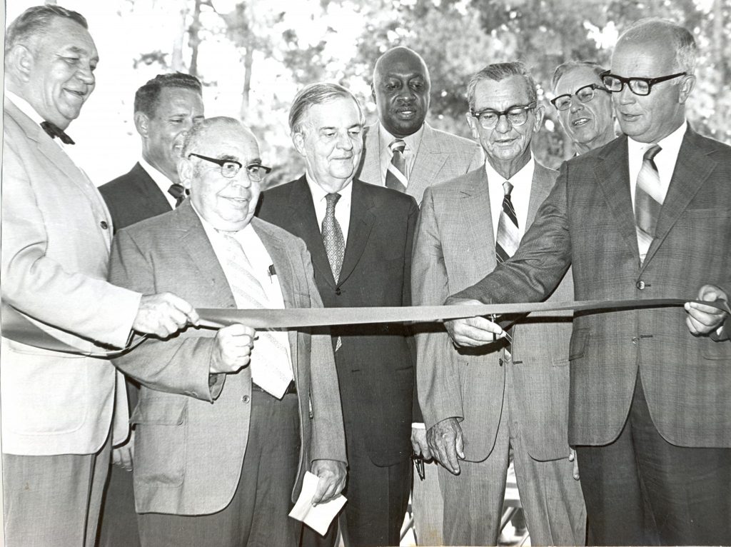 Photo: The 1970 ribbon-cutting ceremony for the new vocational training facility – the J.F. Havens Building – at Edgecombe Technical Institute. Pictured left to right: Jack F. Havens, chairman of the board of trustees; Charles McIntyre, president; R.D. Armstrong, trustee; Peyton Berry, vice president of TEDCO; Dr. Moses Ray, trustee; Zeb Brinson, chairman of the Edgecombe County Board of Education; Berry Anderson, county commissioner; and Hassell Thigpen, chairman of the county commissioners.