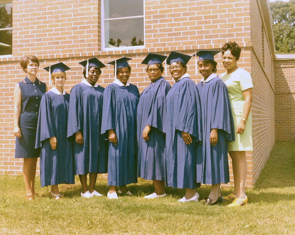 Photo: A trained beautician is in constant demand,” stated the ETI catalog in 1972. Pictured are (left) instructor Vivian Godwin and (right) instructor Hattie Jordan with that year’s graduates in cosmetology.